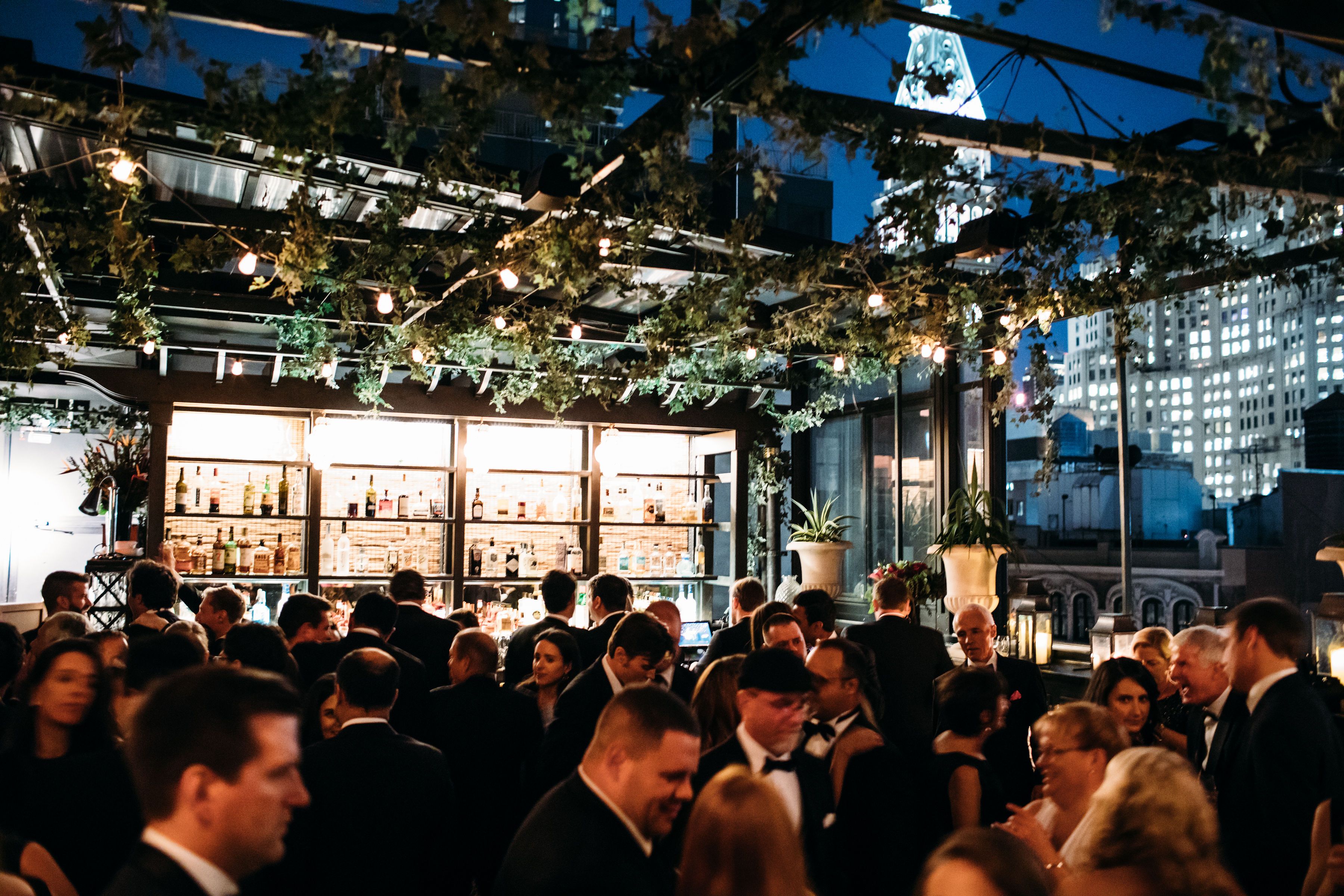 Wedding guests dancing at a Brooklyn rooftop reception